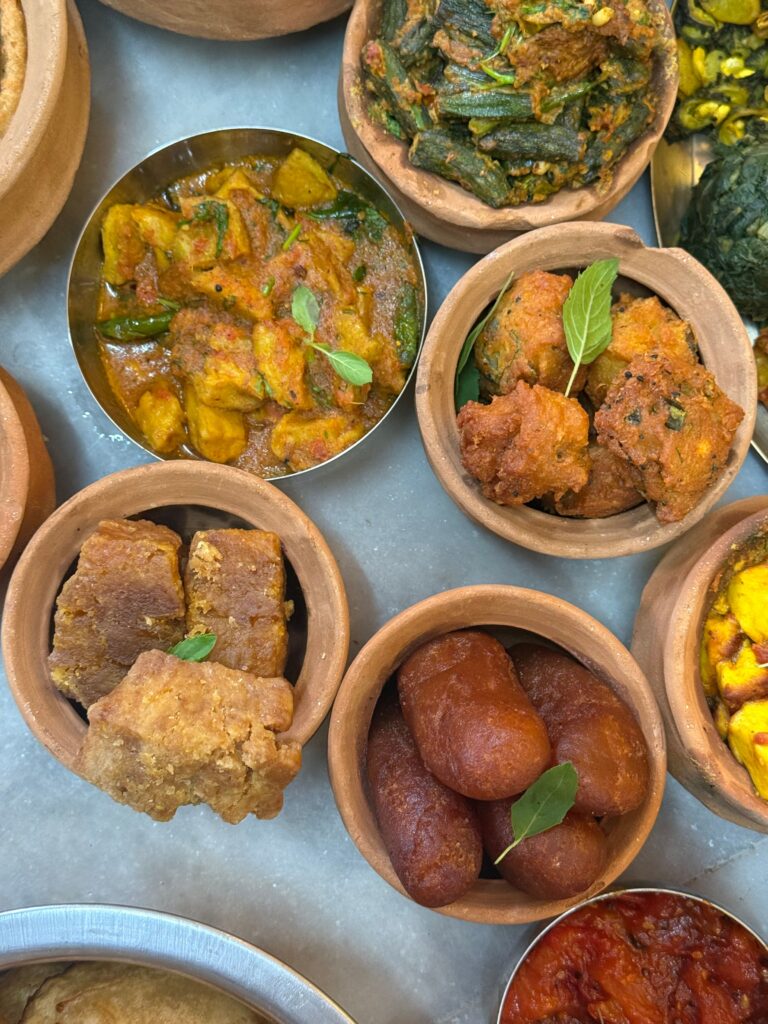 Wholesome vegetarian dishes in clay pots, showcasing traditional Sattvic Ahara preparation